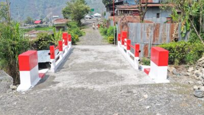 Kodim 1714/Puncak Jaya Jembatan Beton Merah Putih Tahap VII Ke-2 Resmi Digunakan Masyarakat Kampung Kulok Enggame Distrik Pagaleme